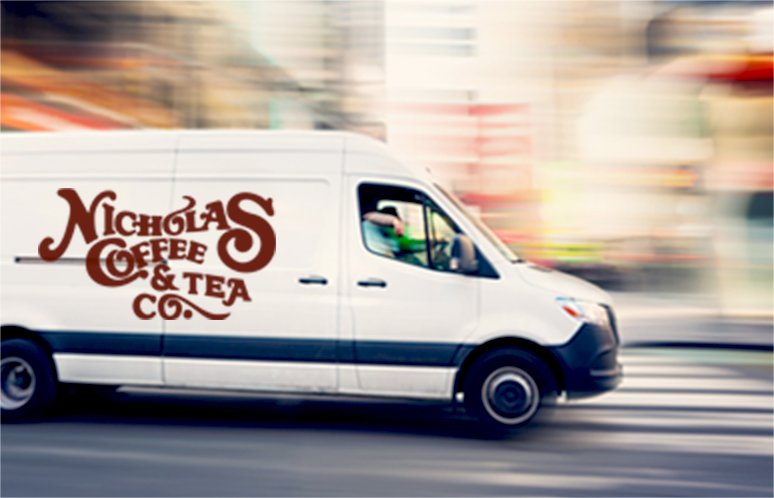 Delivery white van with nicholas Coffee logo in Manhattan around Times Square area