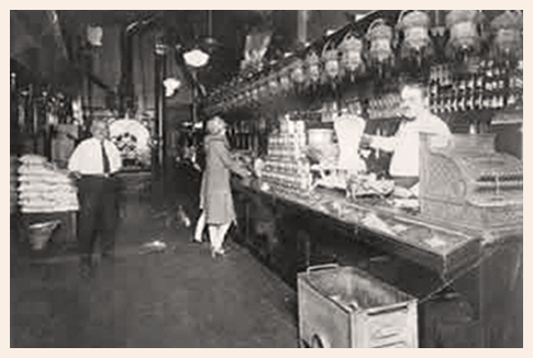 Black and white image of Nicholas Coffee & Tea Co's inside of the store in 1920.