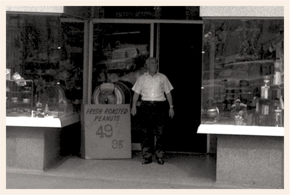 Black and white image of Nicholas Coffee & Tea Co's outside of the store in 1957.