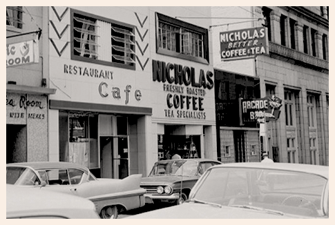 Black and white image of Nicholas Coffee & Tea Co's outside of the store in 1957.